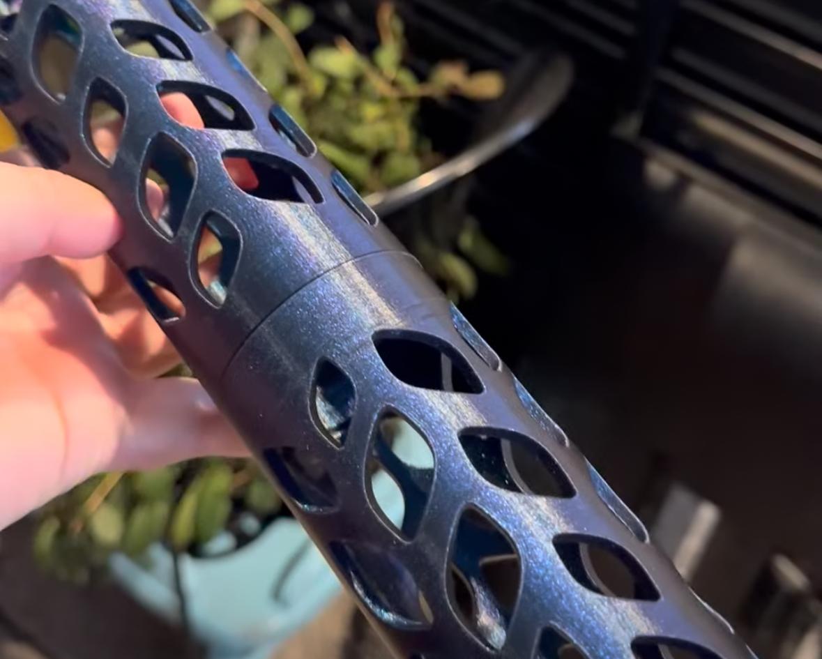 A 3D printed moss pole from a blue sparkled filament