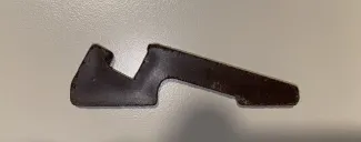 a leg from rummy tile used to prop up the game board