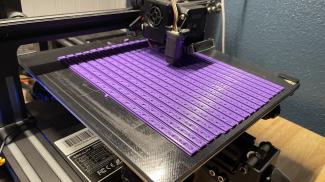 3d printer printing purple petg