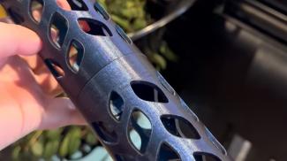A 3D printed moss pole from a blue sparkled filament
